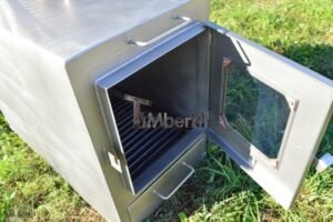 Stufa a legna esterna TimberIN Nordic External in acciaio inox con porta in vetro, in giardino